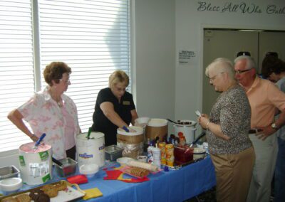 Lady scooping ice cream at an ice cream socia